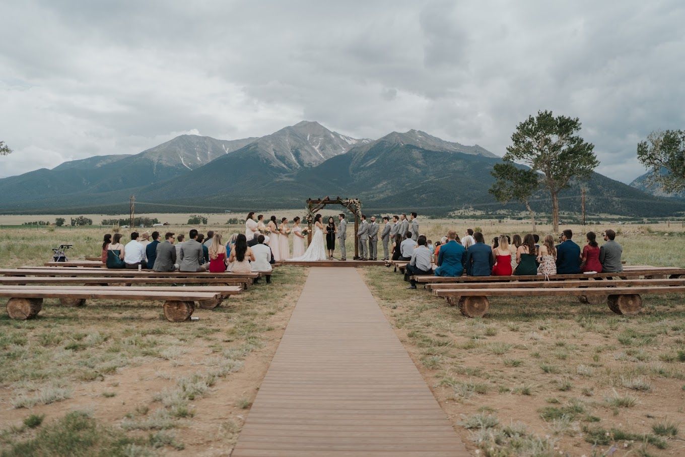 Outdoor wedding ceremony with mountain backdrop