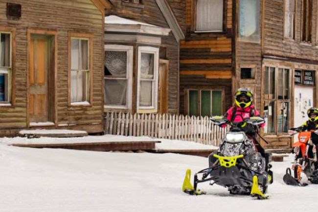 Two people snowmobiling in Buena Vista / Salida CO