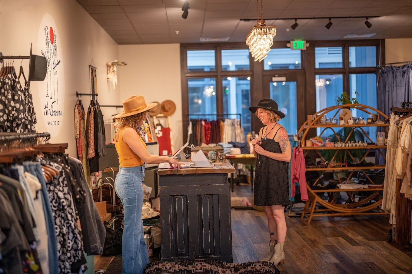 Two women chatting in a clothing boutique