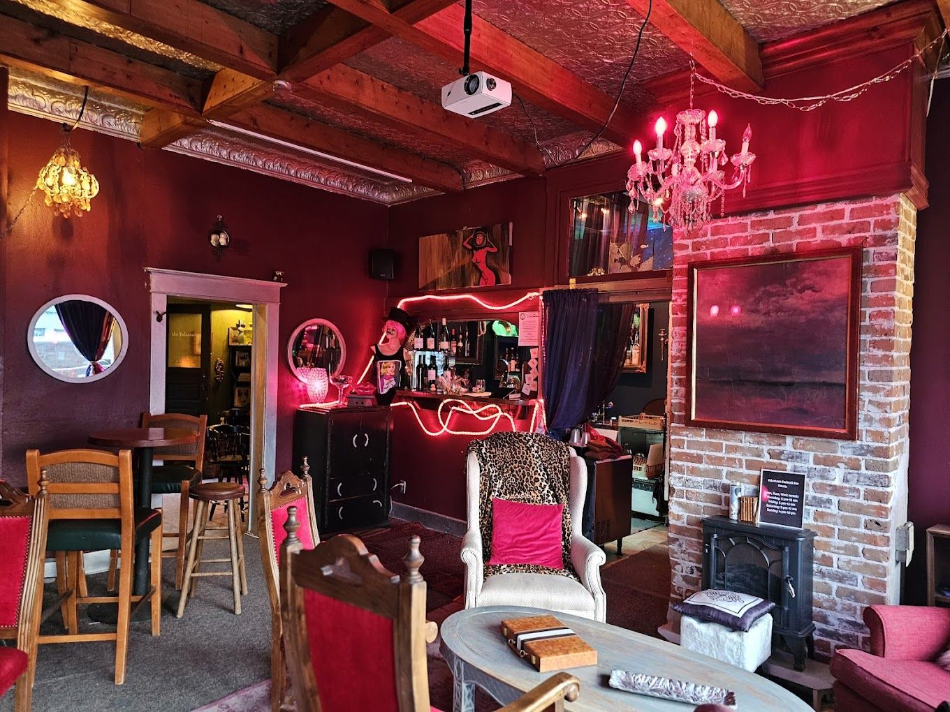 Cozy vintage-style bar interior with eclectic decor.